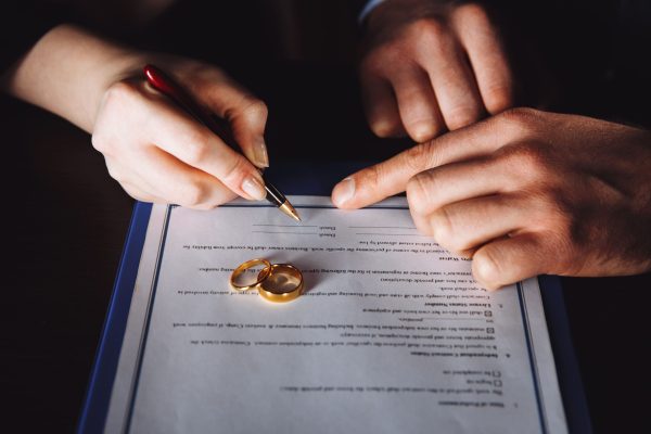 marriage-contract-sign-concept-man-woman-signing-documents